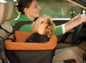 A Cozy And Safe Booster Seat That Allows Your Dog To See Out The Windows