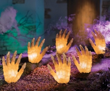 Lighted Hands Reaching Out Of The Grave